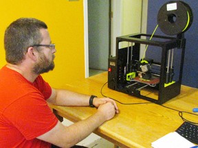 Shawn Jeansonne tries the 3-D printer now available to the public at the Sarnia Library as part of makerspace, which was formally opened Saturday afternoon.Photo taken in Sarnia, Ontario on Saturday, June 25, 2016 (NEIL BOWEN, Sarnia Observer)