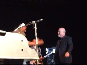 Billy Joel surprises fans at a tribute band concert. (Screen shot)