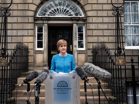 First Minister Nicola Sturgeon speaks to the media outside Bute House,  following an emergency Scottish cabinet meeting in Edinburgh, Scotland, Saturday, June 25, 2016. (Jane Barlow/PA via AP)