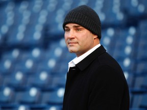 In a Dec. 30, 2011 file photo, former Philadelphia Flyers player Eric Lindros looks out from the stands at Citizens Bank Park where preparations are underway for NHL hockey's Winter Classic, in Philadelphia. (AP Photo/Matt Rourke)