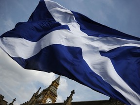 The Scottish flag flies in Lodnon on May 15, 2015. (AFP PHOTO / ADRIAN DENNIS)
