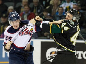 London Knights defenceman Jacob Graves fights with Saginaw Spirit defenceman Keaton Middleton during an OHL game at Budweiser Gardens in London on Jan. 15, 2016. (Craig Glover/The London Free Press/Postmedia Network)