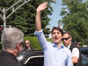 Prime Minister Justin Trudeau waves as he leaves the Fete Nationale celebration Friday, June 24, 2016 in Ste. Therese, Que. (THE CANADIAN PRESS)