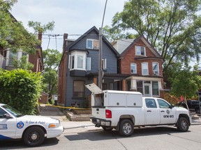 A man was fighting for his life after a fire at a home on Landsdowne Ave., near Queen St. (ERNEST DOROSZUK, Toronto Sun)