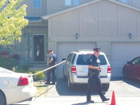 City police secure a northwest London townhouse where a man was shot Saturday. (AZZURA LALANI, The London Free Press)