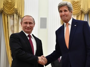 U.S. Secretary of State John Kerry, right, shakes hands with Russian President Vladimir Putin at the Kremlin in Moscow, Russia, Thursday, March 24, 2016.  (Alexander Nemenov/Pool Photo via AP)