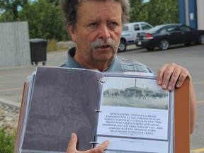 Kootenai Brown curator Farley Wuth shows off one of his new historical pages during a tour on Main Street.