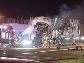 Firefighters attend the scene of a multi-vehicle crash in Toronto on Friday June 24, 2016. The fiery collision happened Friday night on Highway 400 between Finch Avenue and Highway 401. THE CANADIAN PRESS/Victor Biro