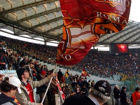 Fervent fans at European soccer matches often spend the whole game chanting slogans and waving flags. (photo: Rick Steves)