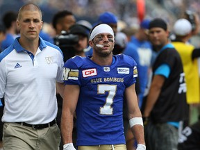 Winnipeg Blue Bombers WR Weston Dressler leaves the field with medical staff after taking a heavy hit by a Montreal Alouette during CFL action at Investors Group Field Winnipeg on Fri., June 24, 2016. Kevin King/Winnipeg Sun/Postmedia Network