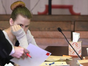 In this May 11, 2016, file photo, former Muskingum University student Emile Weaver looks at an exhibit during her trial in Muskingum County Common Pleas Court in Zanesville, Ohio. (Chris Crook/Times Recorder via AP, Pool, File)