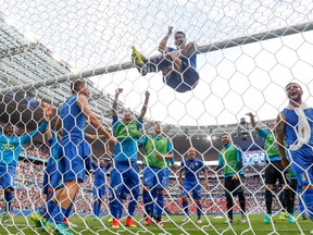 Italy goalkeeper Gianluigi Buffon, centre, and his teammates celebrate at the end of the Euro 2016 Round of 16 match against Spain at the Stade de France, in Saint-Denis, north of Paris, on June 27, 2016. (AP Photo/Martin Meissner)