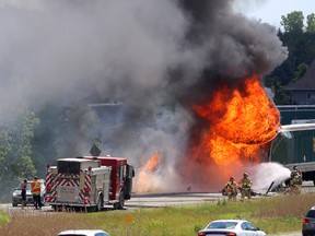 Two transports and a car were involved in a collision on eastbound 402 just east of the Wonderland Road overpass in London, Ont. on Monday June 27, 2016. 
Traffic was backed up earlier due to a truck going into a ditch just west of Wonderland, and it appears the one truck rear ended another semi.
Several people were taken to hospital. (MIKE HENSEN, The London Free Press)