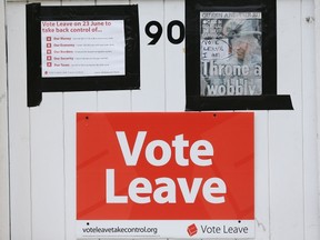 "Vote Leave" posters are displayed on the gate of a house in Redcar, north east England on June 27, 2016. (AFP PHOTO)