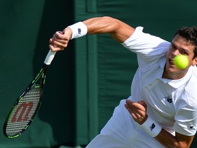 Canada’s Milos Raonic serves against Spain’s Pablo Carreno Busta during their first-round match of Wimbledon in London June 27, 2016. (AFP PHOTO/GLYN KIRK)