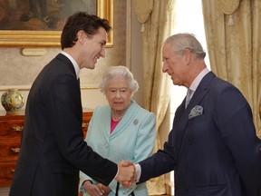 Canada's Prime Minister Justin Trudeau shakes hands with Britain's Prince Charles as Queen Elizabeth looks on during a reception in the San Anton Palace in Attard, Malta.(REUTERS/John Stillwell/Pool).