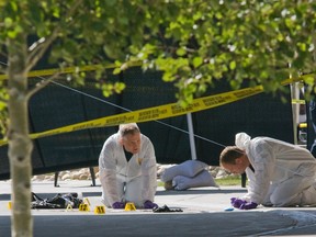 Investigators look for evidence after Mohamed Ali Ibrahim was shot outside the River Cree Casino in August 2008.