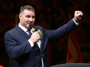 Eric Lindros addresses the fans during a pregame ceremony inducting him and former teammate John LeClair into the Flyers Hall of Fame before a game November 20, 2014 at the Wells Fargo Center in Philadelphia. (Elsa/Getty Images/AFP)