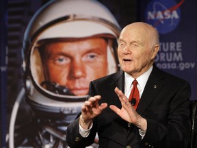 In this Feb. 20, 2012, file photo, U.S. Sen. John Glenn talks with astronauts on the International Space Station via satellite before a discussion titled "Learning from the Past to Innovate for the Future" in Columbus, Ohio. (AP Photo/Jay LaPrete, File)