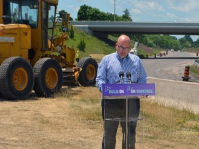 Ontario Transportation Minister Steven Del Duca speaks at a pop-up press conference at the Hwy. 3 and First Ave. on ramp Monday afternoon. Del Duca announced applications are being accepted for the Connecting Links program, an initiative that helps eligible municipalities link their roads to provincial highways.