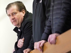 Vancouver Canucks general manager Jim Benning watches the NHL team's practice in Vancouver on March 11, 2016. (THE CANADIAN PRESS/Darryl Dyck)