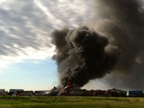 In this photo provided by Billy B. Brown, two freight trains are on fire Tuesday, June 28, 2016, after they collided and derailed near Panhandle, Texas. Texas Department of Public Safety Lt. Bryan Witt says the accident occurred Tuesday morning near the town of Panhandle, about 25 miles northeast of Amarillo. No injuries have been reported. (Billy B. Brown via AP)