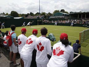 Canada's Vasek Pospisil (top) returns against Spain's Albert Ramos-Vinolas during their men's singles first round match on the second day of the Wimbledon Championships at The All England Lawn Tennis Club in Wimbledon, southwest London, on Tuesday, June 28, 2016. (Adrian Dennis/AFP Photo)