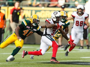 Eskimos' Deon Lacey (40) chases Redblacks' Travon Van (3) during CFL action at the Brick Field at Commonwealth Stadium in Edmonton on June 25, 2016. (Ian Kucerak/Postmedia Network)