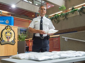 Edmonton Police Service Insp. Dwayne Lakusta at EPS Headquarters with 16 kilograms of seized cocaine and methamphetamine worth $900,000 on June 28, 2016. Police have charged Ho Tran, 47 with possession for the purpose of trafficking. Shaughn Butts / Postmedia Network