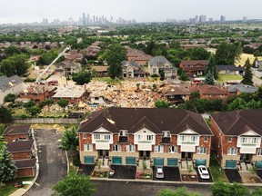 An explosion in Mississauga, Ont., levelled one home and severely damaged 24 others on Tuesday, June 28, 2016. One person is dead and several others injured. The cause of the blast has not yet been determined. (Stan Behal/Toronto Sun/Postmedia Network)