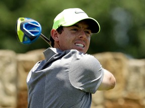 In this June 18, 2016 file photo, Rory McIlroy, of Northern Ireland, watches his tee shot on the ninth hole during the rain delayed second round of the U.S. Open golf championship at Oakmont Country Club, in Oakmont, Pa. (AP Photo/Charlie Riedel, File)