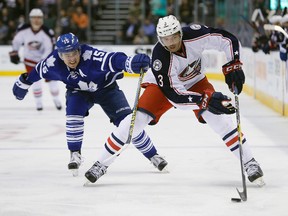 Columbus Blue Jackets defenseman Seth Jones carries the puck past Toronto Maple Leafs forward P.A. Parenteau at the Air Canada Centre in Toronto on April 6, 2016. (John E. Sokolowski/USA TODAY Sports)