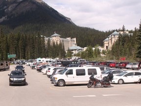 Cars circle around to find available parking outside of the Fairmont Chateau Lake Louise on June 28, 2016. A new traffic management initiative was released that will see buses run visitors from the overflow parking lot, into Lake Louise to help alleviate traffic in the area. (Zach Laing / Crag & Canyon / Postmedia Network)