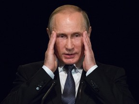 Russian President Vladimir Putin gestures as he addresses students during his visit to German Embassy school in Moscow, Russia, Wednesday, June 29, 2016. Putin has offered his condolences to Turkey which was hit by suicide attacks on Tuesday, killing dozens at Istanbul's airport. (AP Photo/Alexander Zemlianichenko, pool)