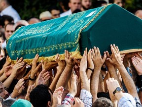 People carry the coffin of suicide attack victim Mohammad Eymen Demirci on Wednesday in Istanbul during his funeral, a day after a suicide bombing and gun attack targeted Istanbul's Ataturk airport, killing 41 people. Turkey pointed the finger of blame at Islamic State jihadists on Wednesday after suicide bombers armed with automatic rifles attacked Istanbul's main international airport. (AFP PHOTO/OZAN KOSE)