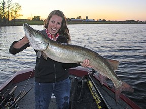 Ashley Rae of SheLovesToFish.com with a memorable catch, a 50-inch musky caught on a topwater lure.