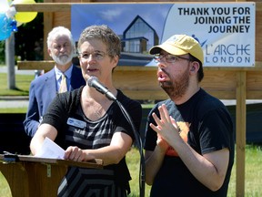 Marietta Drost, executive director of L'Arche London, and Mike Hoadley, a member of the L'Arche community, speak during the sod turning for the L'Arche London Gathering Place in Lambeth on Wednesday. (MORRIS LAMONT, The London Free Press)
