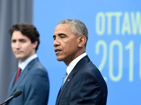 Canadian Prime Minister Justin Trudeau looks on as  US President Barack Obama speaks during a press conference at the North American Leaders Summit at the National Gallery of Canada June 29, 2016 in Ottawa, Ontario. (AFP PHOTO/Brendan Smialowski)
