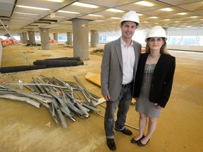 David Ciccarelli, chief executive of Voices.com and his wife Stephanie Ciccarelli, chief brand officer, look over their new office space in the Bell Building on Wednesday. (MORRIS LAMONT, The London Free Press)