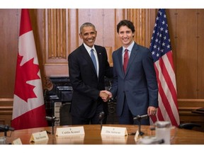 US President Barack Obama (L) and Canadian Prime Minister Justin Trudeau shake hands before a meeting in the Cabinet Room at Parliament Hill while attending the North American Leaders Summit on June 29, 2016 in Ottawa