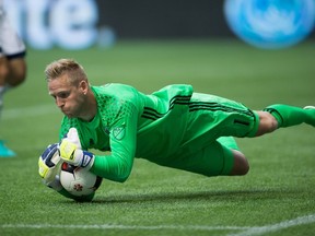 Vancouver Whitecaps goalkeeper David Ousted makes a save against Toronto FC during the Canadian Championship final in Vancouver, B.C., on Wednesday June 29, 2016. (THE CANADIAN PRESS/Darryl Dyck)