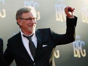 Steven Spielberg, director/co-producer of "The BFG," waves to photographers at the premiere of the film at the El Capitan Theatre on Tuesday, June 21, 2016, in Los Angeles. (Photo by Chris Pizzello/Invision/AP)
