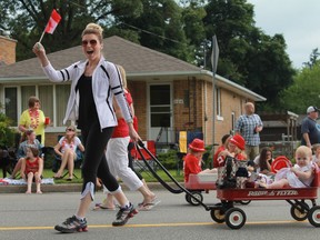 Patriotic fervour overtakes a young girl and her mother during Sarnia's Canada Day parade in 2015. (Postmedia Network file photo)