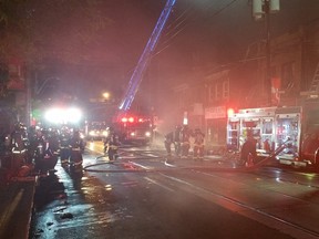 Toronto firefighters battle a five-alarm blaze at Dundas and Bathurst Sts. The fire broke out at 11:30 p.m. on June 29, 2016 and took several hours to get under control. (Toronto Fire photo/Twitter)