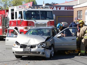 A woman was transported to hospital following a two-vehicle collision at the intersection of College and Pine Streets in Sudbury this morning. John Lappa/Sudbury Star