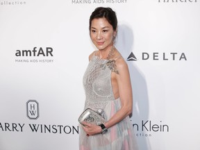 Malaysia actress Michelle Yeoh poses on the red carpet for the fundraising gala organized by amfAR (The Foundation for AIDS Research) in Hong Kong, Saturday, March 19, 2016. (AP Photo/Kin Cheung)