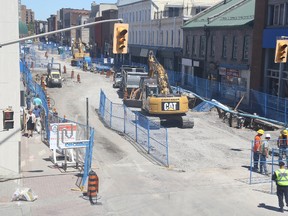 Jason Miller/The Intelligencer
All the underground work on Front Street is a week away from completion. Crews are pictured here filling in some of the excavations done to access sewer and water lines. Plans are to reopen traffic on Front Street in August.