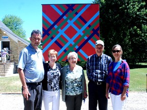 A barn quilt that was once at the farm of settlers Duncan and Isabel McKillop on Talbot Line in West Elgin was officially unveiled Wednesday after being moved to the Eagle Community Centre. In front of the quilt are left Brian Masschaele, director of cultural services, Elgin county, Janet Given, president of the Eagle Community Centre, Betty McKillop, Mike Baker, Elgin county museum curator and Beth McLellan, daughter of Betty McKillop.