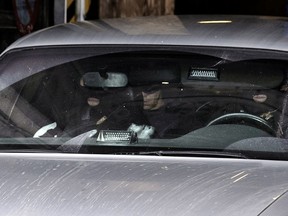 Belgian police officers leave the Brussels Palace of Justice in a car after the appearance before the council chamber of two individuals arrested in connection with the November 13 attacks in Paris, in Brussels on Nov. 20, 2015. Mohammed Amri and Hamza Attou were arrested in Belgium and charged with "a terrorist act and participation in the activities of a terrorist group." (NICOLAS LAMBERT/AFP/Getty Images)