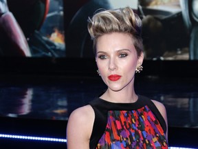 In this April 21, 2015, file photo, Scarlett Johansson poses for photographers upon arrival at the premiere for the film 'The Avengers Age of Ultron' in London. Box Office Mojo has crowned Johansson as Hollywood's highest grossing actress on a list updated June 29, 2016.(Photo by Joel Ryan/Invision/AP, File)